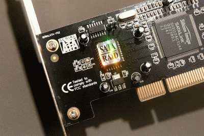 3|4: A shiney SATA label and a Silicon Image Sil3112ACT144.
